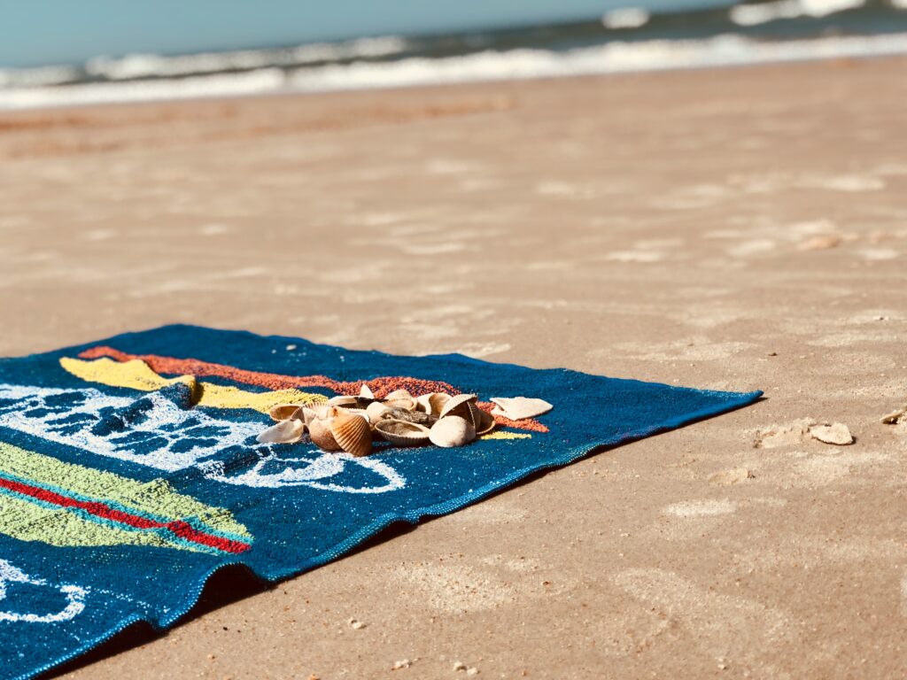 summer beach towel on sand
